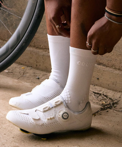 cyclist pulling up white hifi socks