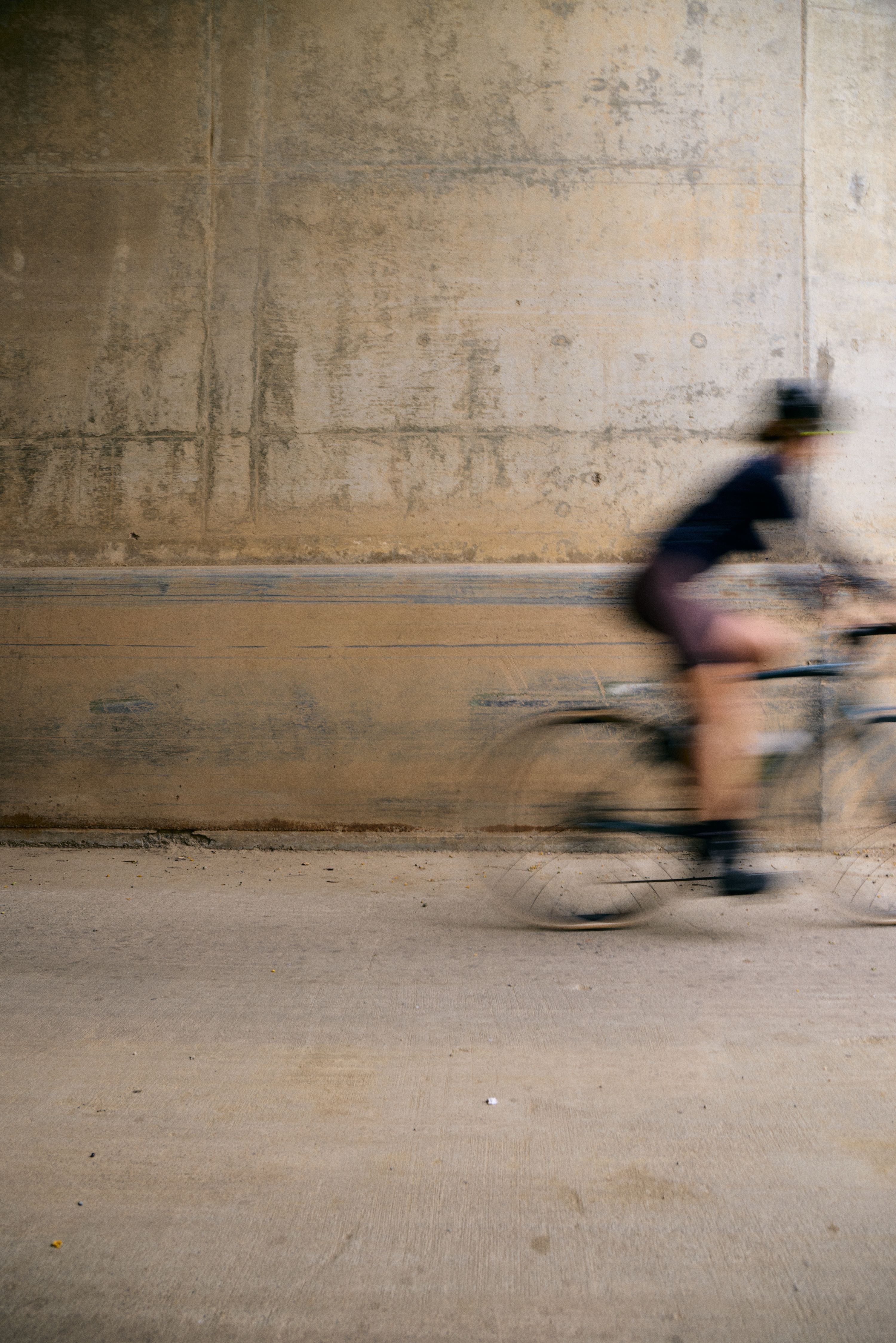 cyclist in motion wearing black courier socks